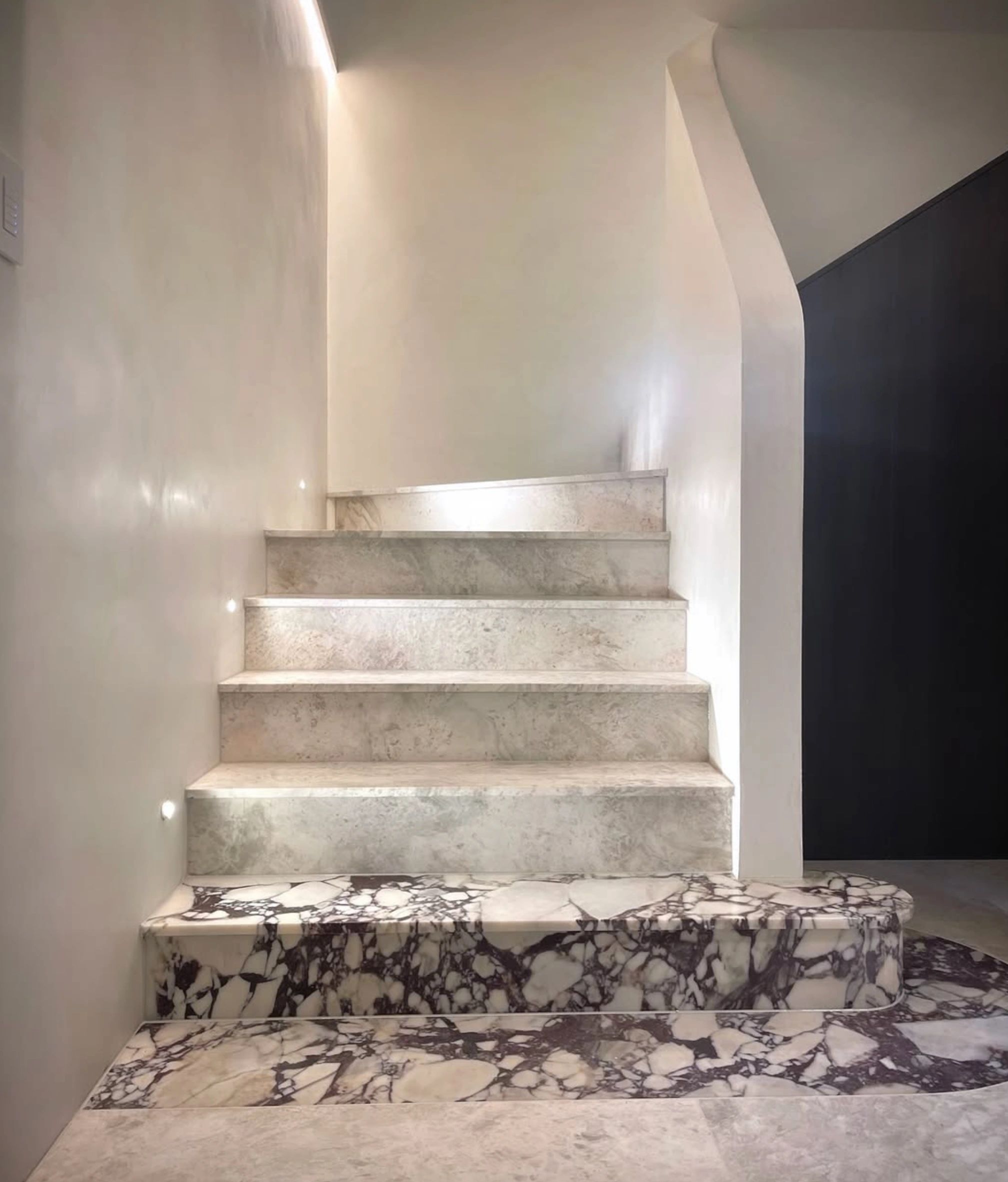 Minimalist concrete staircase marble landing